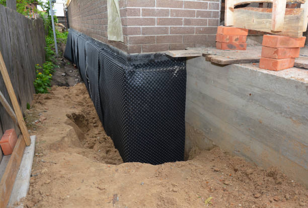SJ Waterproofing Pros technician performing targeted Exterior Waterproofing assessment in Alden, KS